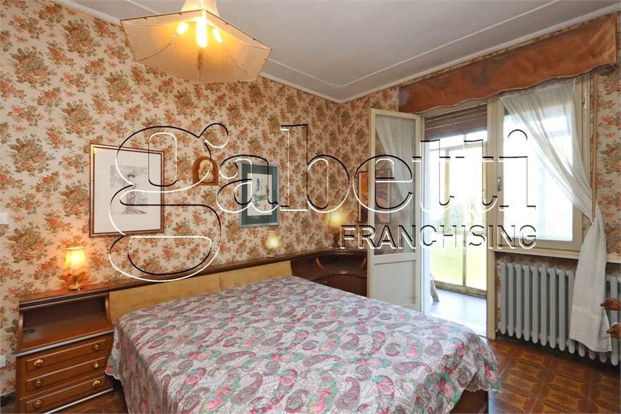 Camera da letto con balcone verandato